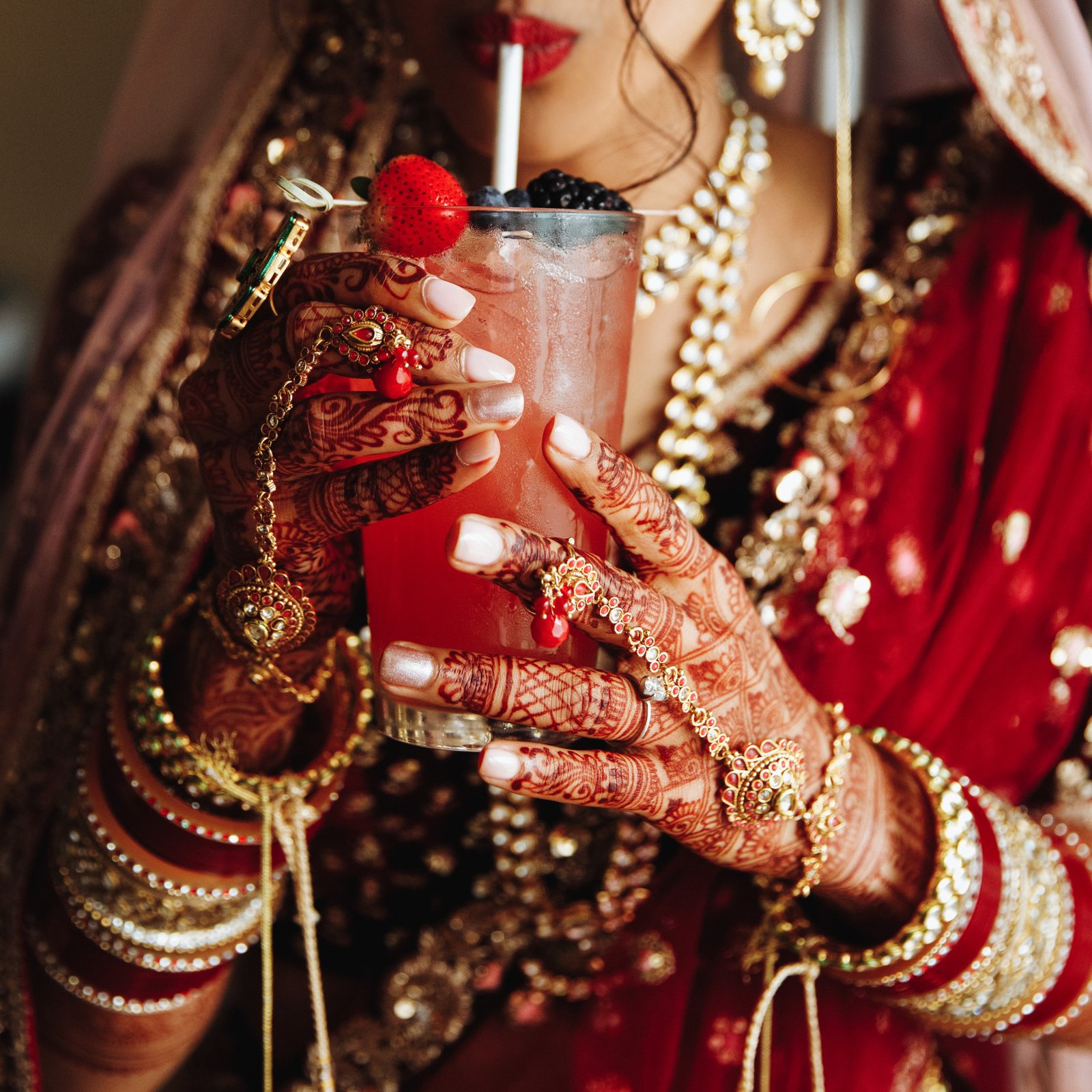 crop-frontview-indian-bride-is-drinkinkg-cocktail-traditional-attire crop-frontview-indian-bride-is-drinkinkg-cocktail-traditional-attire